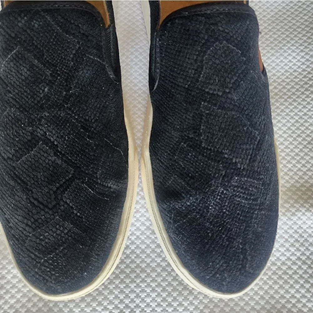 OluKai Black and White Flats Sleek Slip-On Design